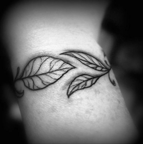 Black And White Leaves Tattoo On Wrist