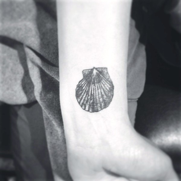 Black And White Seashell Tattoo On Wrist