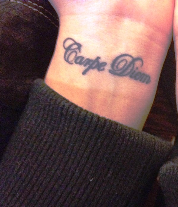 Black Ink Carpe Diem Tattoo On Wrist