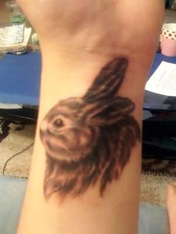 Grey Ink Rabbit Tattoo On Left Wrist