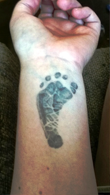 Grey Inked Footprint Tattoo