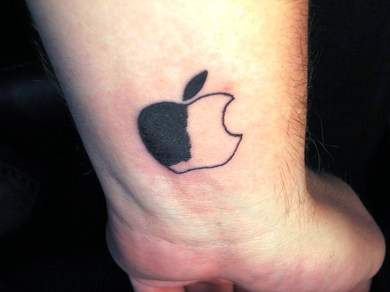 Half Black Apple Tattoo On Wrist