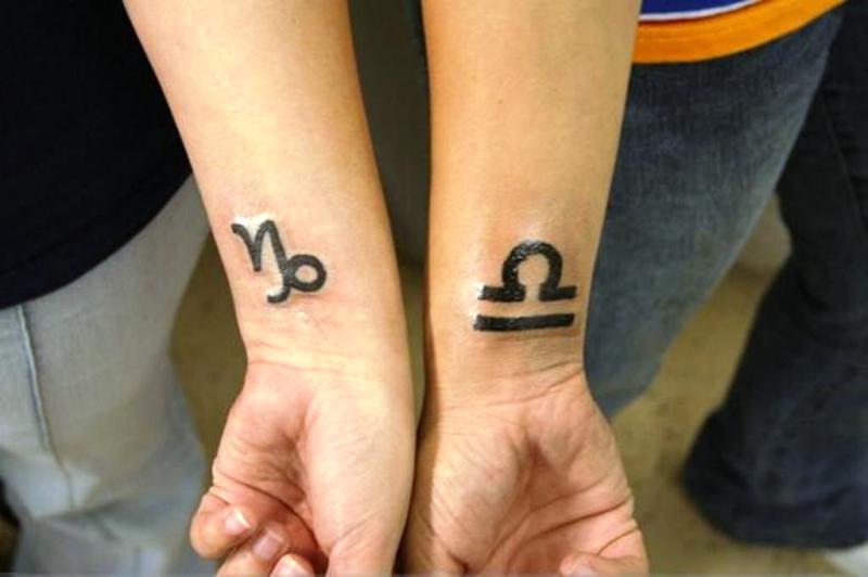 Libra And Capricorn Tattoo On Wrist