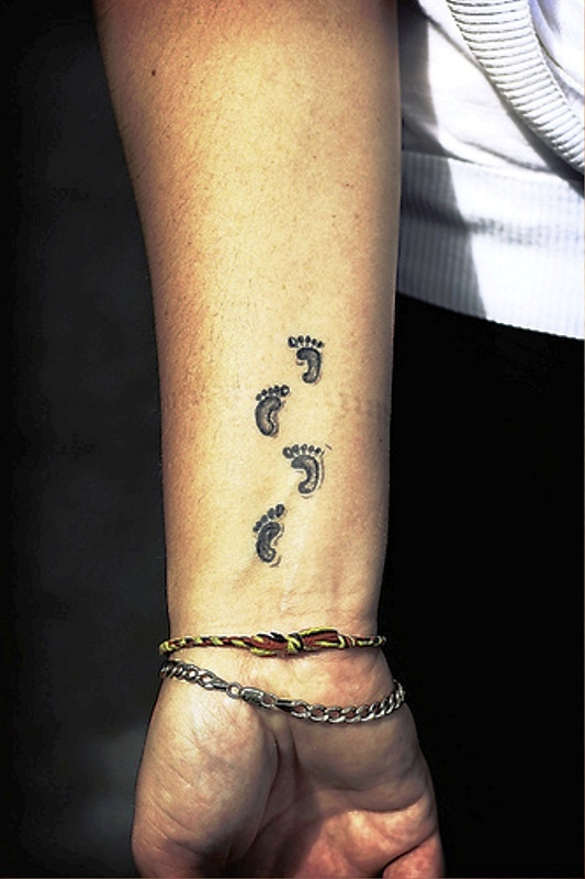 Little Footprints Tattoo On Wrist