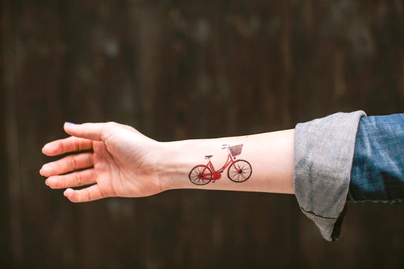 Red Cycle Tattoo On Wrist