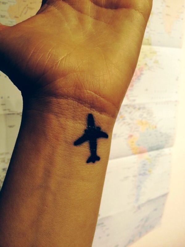 Simple Plane Tattoo On Wrist